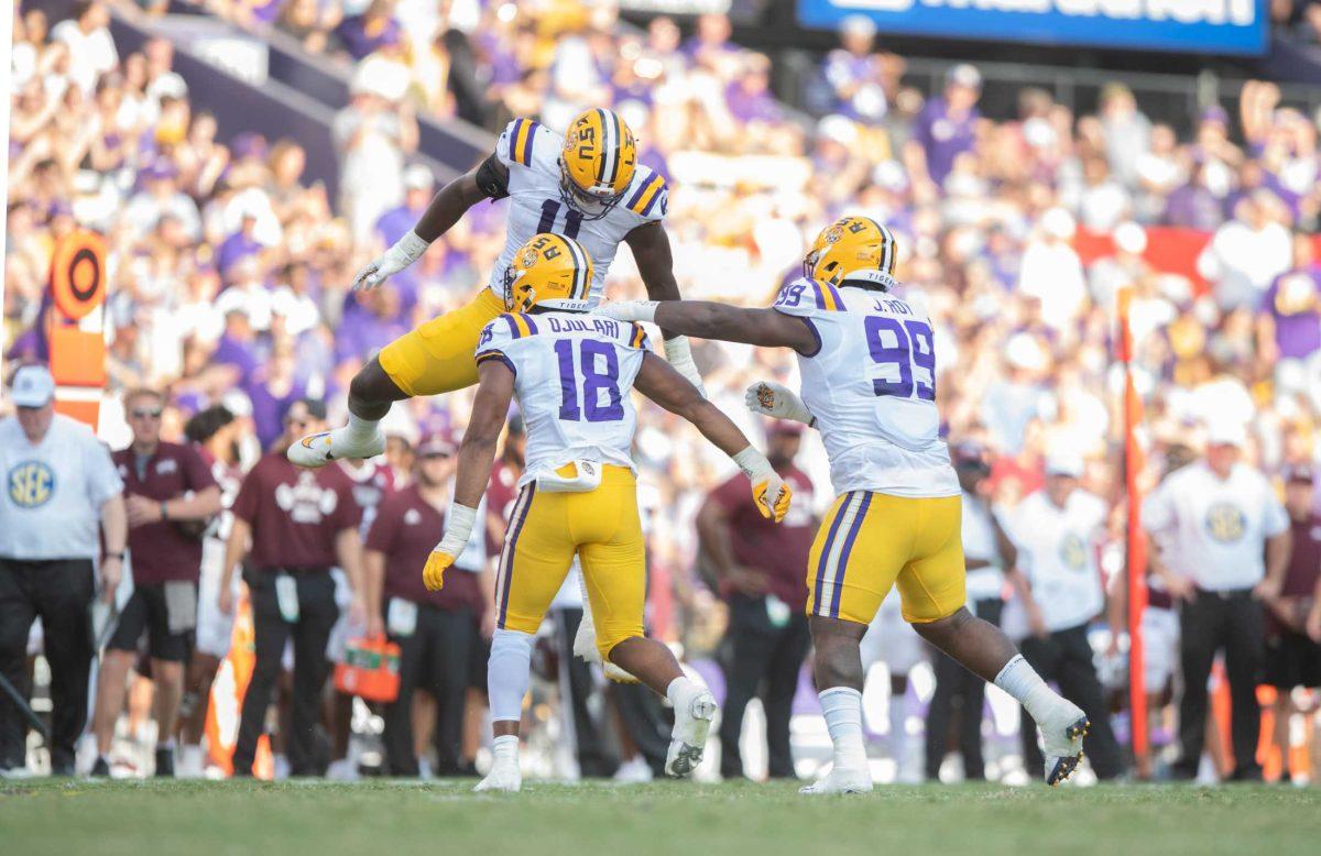 LSU football fifth-year senior defensive end Ali Gaye (11) celebrates with LSU football junior defensive end BJ Ojulari (18) and LSU football junior defensive tackle Jaquelin Roy (99) on Saturday, Sept. 17, 2022, during LSU&#8217;s 31-16 win against Mississippi State in Tiger Stadium in Baton Rouge, La.