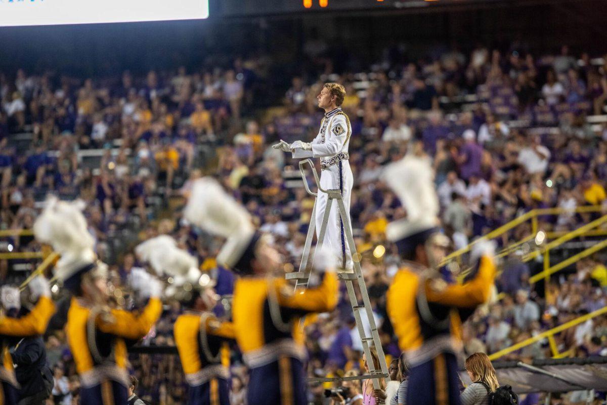 The Drum Major conducts the Golden Band from Tigerland during the half-time performance on Saturday, Sept. 24, 2022, during the LSU vs New Mexico game in Tiger Stadium.