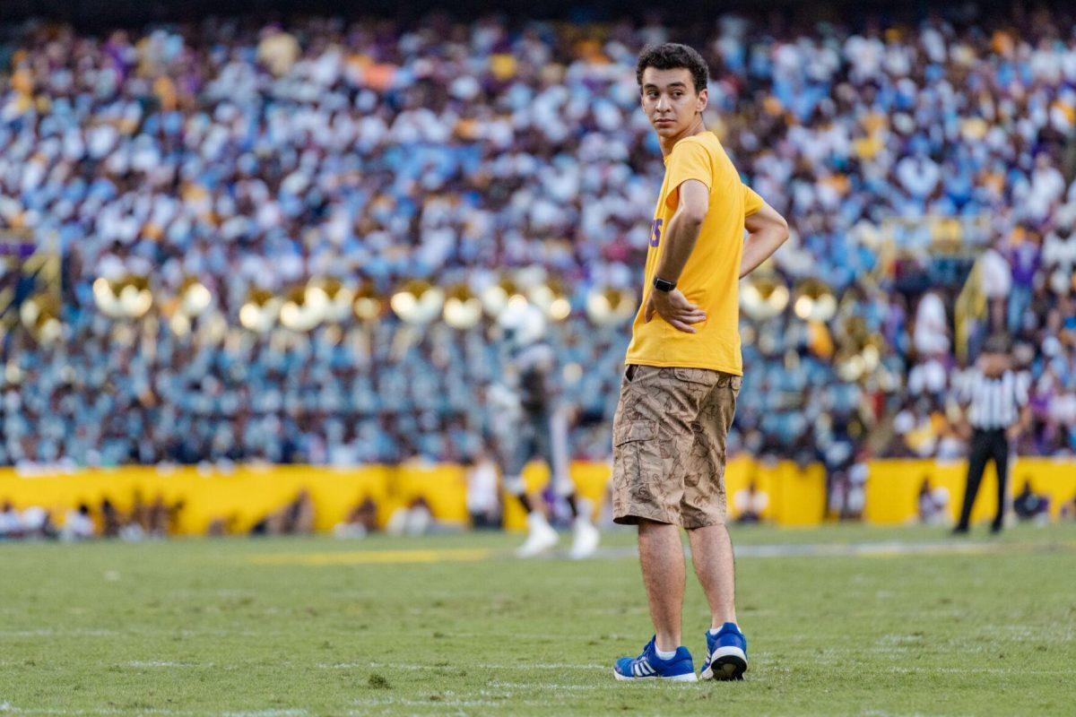 A random person walks on to the field during a play on Saturday, Sept. 10, 2022, during LSU&#8217;s 65-17 win over Southern at Tiger Stadium in Baton Rouge, La.