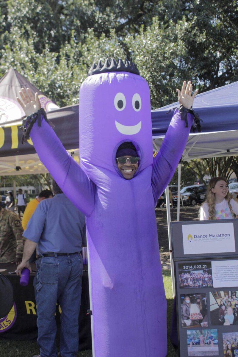 A student dresses as an inflatable tube man a the Dance Marathon booth on Friday, Sept. 16, 2022, during Fall Fest on the LSU Parade Ground.