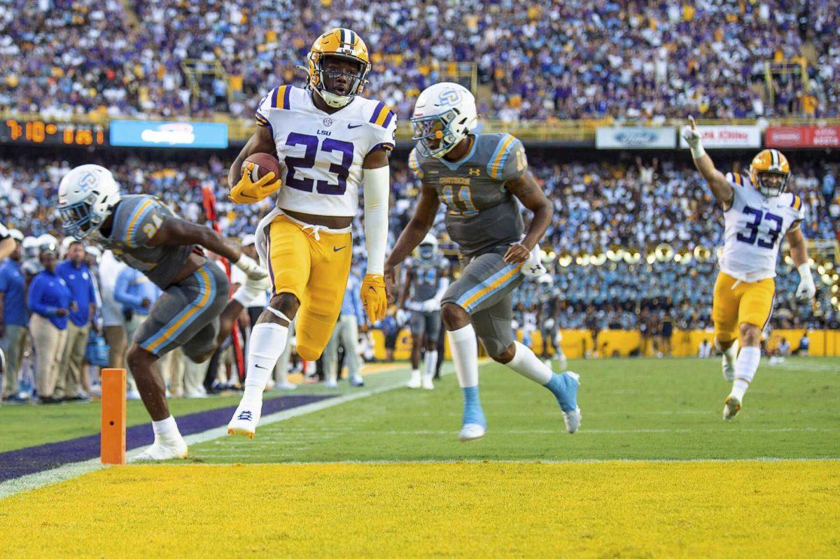 LSU linebacker Micah Baskerville scores on a pass interception against Southern University during an NCAA college football game Saturday, Sept. 10, 2022, in Baton Rouge, La. (Scott Clause/The Daily Advertiser via AP)