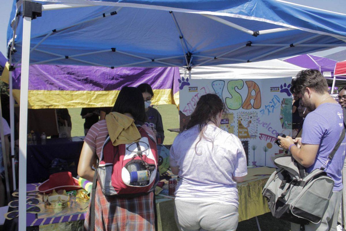 Students visit the Isa Magazine booth on Friday, Sept. 16, 2022, during Fall Fest on the LSU Parade Ground.