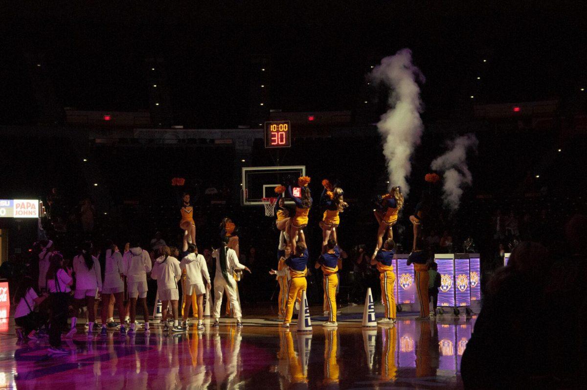 LSU cheerleaders and women's basketball players welcome the starting five before the beginning of an exhibition game against Mississippi College on Thursday, Oct. 27, 2022, in the Pete Maravich Assembly Center on N. Stadium Drive.