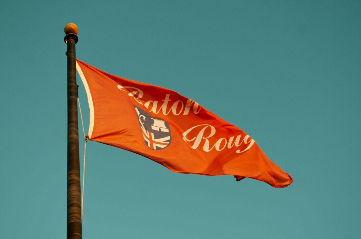 A Baton Rouge flag whips in the wind on Thursday, Oct. 20, 2022, near River Road in Baton Rouge, La.