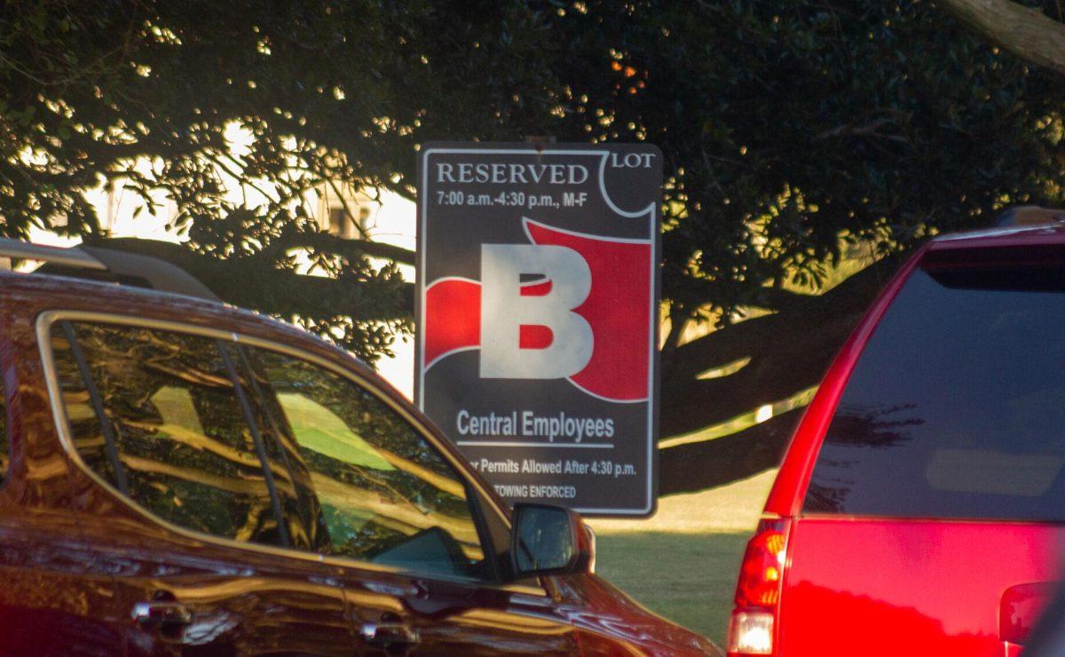 Red cars surround the parking lot sign on Monday, Sept. 26, 2022, on Tower Drive in Baton Rouge, La.