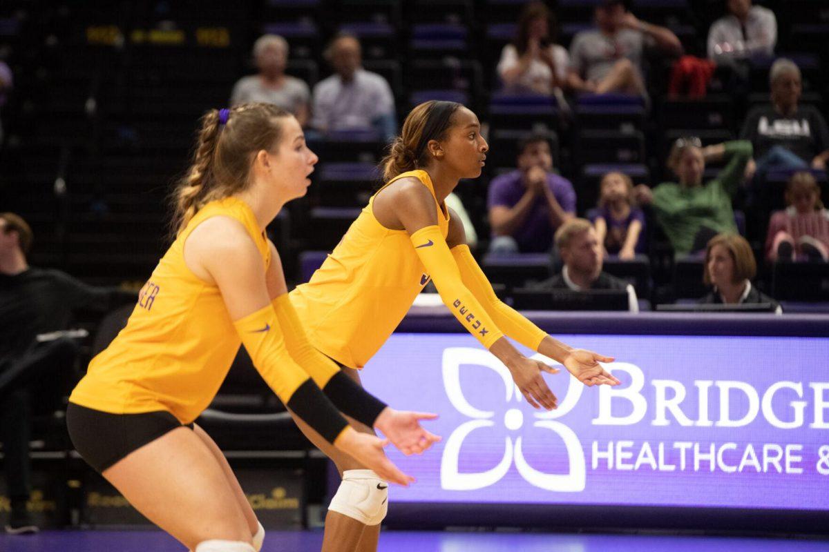 LSU volleyball outside hitters Paige Flickinger (2) and Sanaa Dotson (9) stand ready on Sunday, Oct. 30, 2022, during LSU&#8217;s 3-2 loss to Mississippi State at the Pete Maravich Assembly Center in Baton Rouge, La.