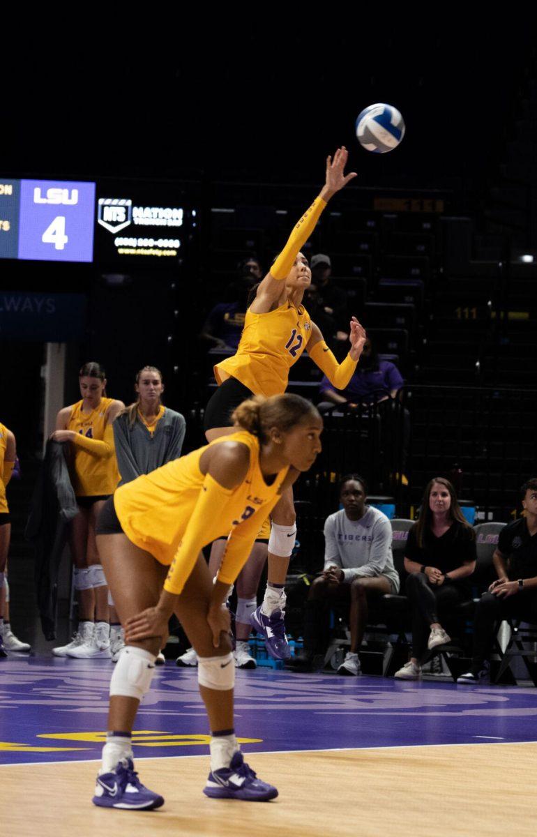 LSU volleyball junior middle blocker Alia Williams (12) serves the ball on Saturday, Oct. 1, 2022, during LSU&#8217;s 2-3 defeat to Ole Miss at the Pete Maravich Assembly Center in Baton Rouge, La.