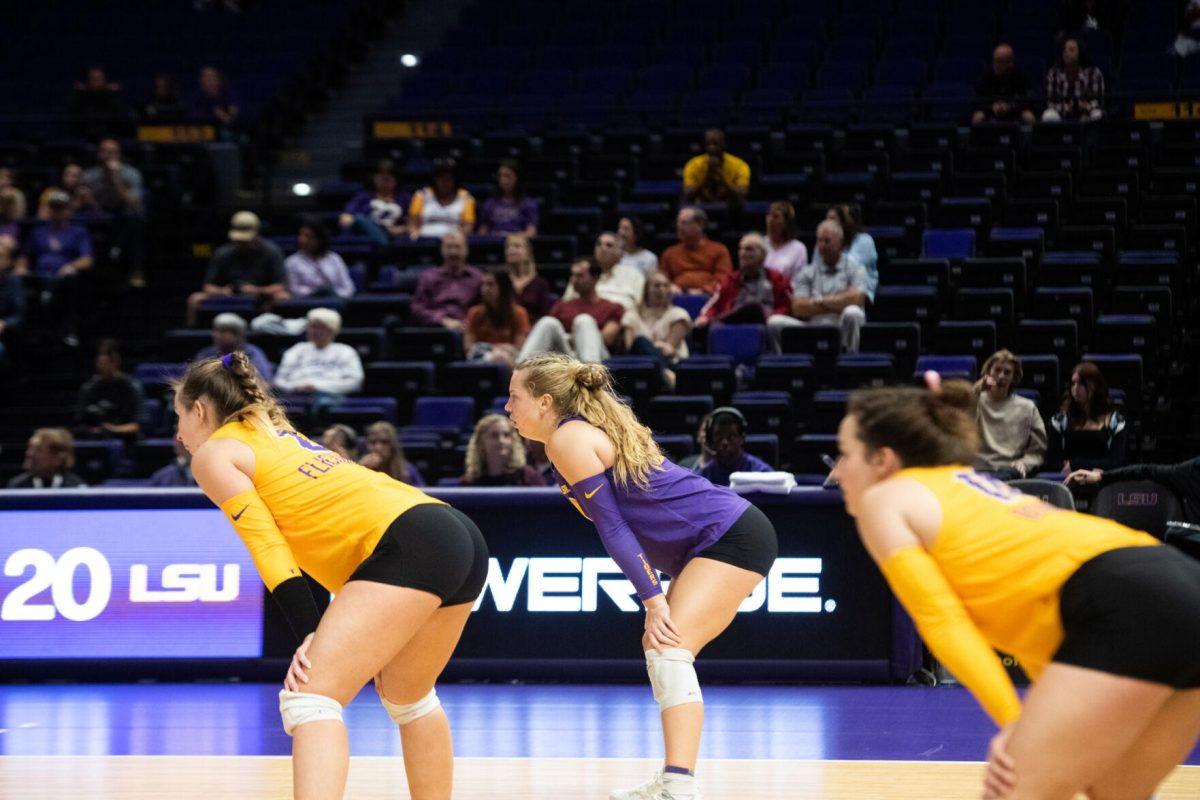 LSU volleyball players Paige Flickinger (2), Ella Larkin (3), and Jill Bohnet (10) stand ready on Sunday, Oct. 30, 2022, during LSU&#8217;s 3-2 loss to Mississippi State at the Pete Maravich Assembly Center in Baton Rouge, La.