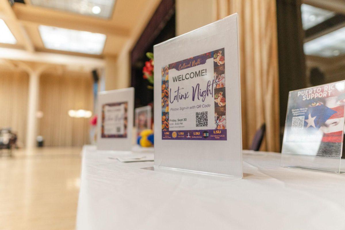 A sign for Latinx Night sits on the welcome table on Friday, Sept. 30, 2022, at the entrance of the LSU Union Ballroom.