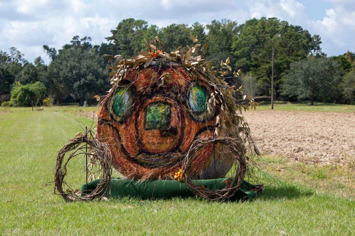 A bale of hay sits decorated as a pumpkin carriage on the Botanic Gardens trail on Wednesday, Oct. 12, 2022, on Essen Ln. in Baton Rouge, La.