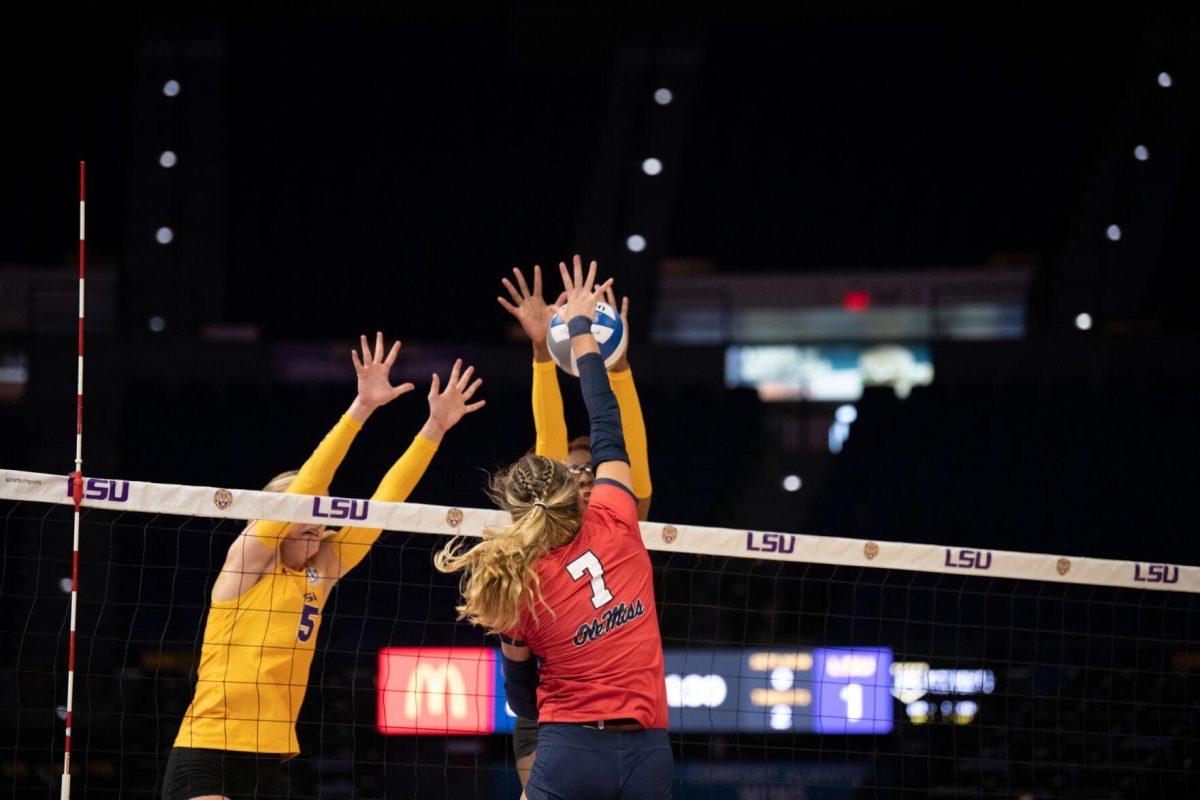 LSU volleyball graduate student Josie Vondran (5) and senior Anita Anwusi (11) attempt to block the ball on Saturday, Oct. 1, 2022, during LSU&#8217;s 2-3 defeat to Ole Miss at the Pete Maravich Assembly Center in Baton Rouge, La.