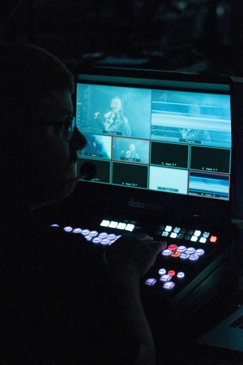 A production staff member manages video effects for large screens backstage on Wednesday, Oct. 19, 2022, at LSU's homecoming concert at the PMAC on North Stadium Drive in Baton Rouge, La.