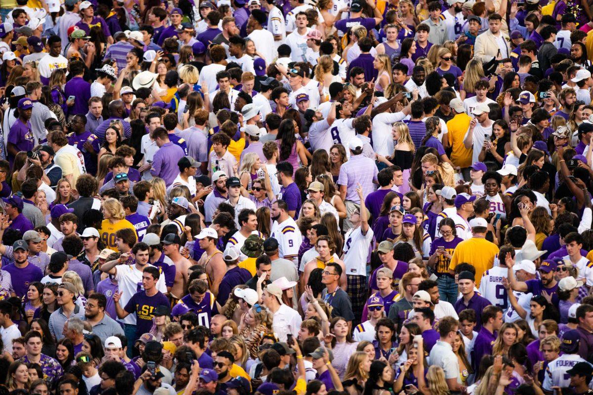 LSU fans storm the football field Saturday, Oct. 22, 2022 after LSU&#8217;s 45-20 win against Ole Miss at Tiger Stadium in Baton Rouge, La.