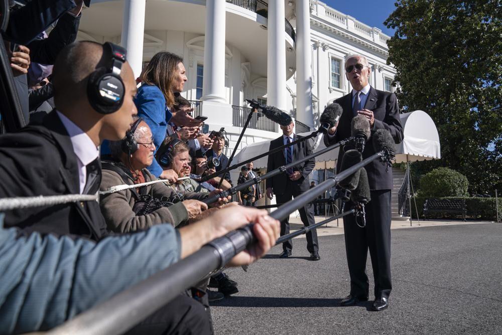 <span>President Joe Biden talks to reporters before boarding Marine One on the South Lawn of the White House, Thursday, Oct. 6, 2022, in Washington. </span>