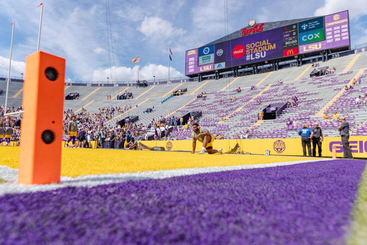 LSU football junior offensive lineman Anthony Bradford (75) stretches on the field on Saturday, Oct. 22, 2022, prior to LSU&#8217;s 45-20 victory over Ole Miss in Tiger Stadium in Baton Rouge, La.