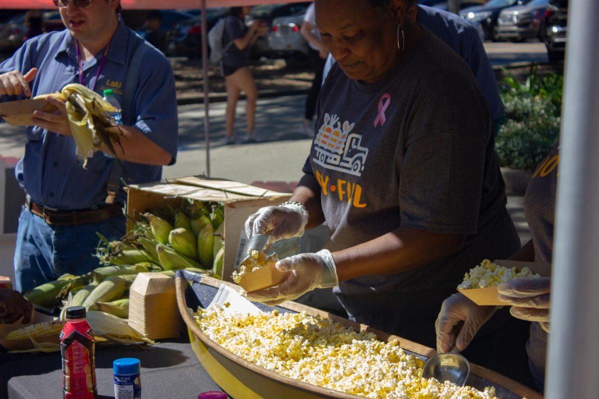 A woman prepares popcorn for LSU students on Wednesday, Oct. 5, 2022, on Tower Drive in Baton Rouge, La.