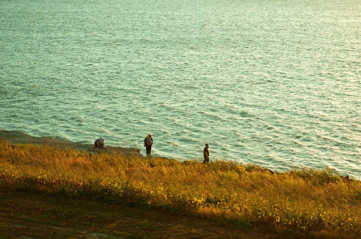 Visitors explore the edge of the Mississippi River on Thursday, Oct. 20, 2022, near River Road in Baton Rouge, La.