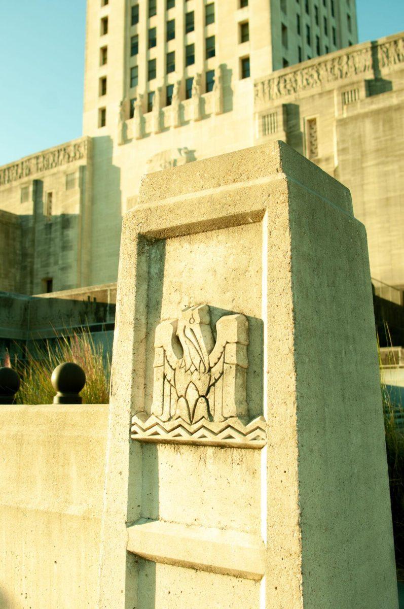 A concrete pillar decorated with a pelican glows in the sunlight on Thursday, Oct. 20, 2022, at the Louisiana State Capitol in Baton Rouge, La.