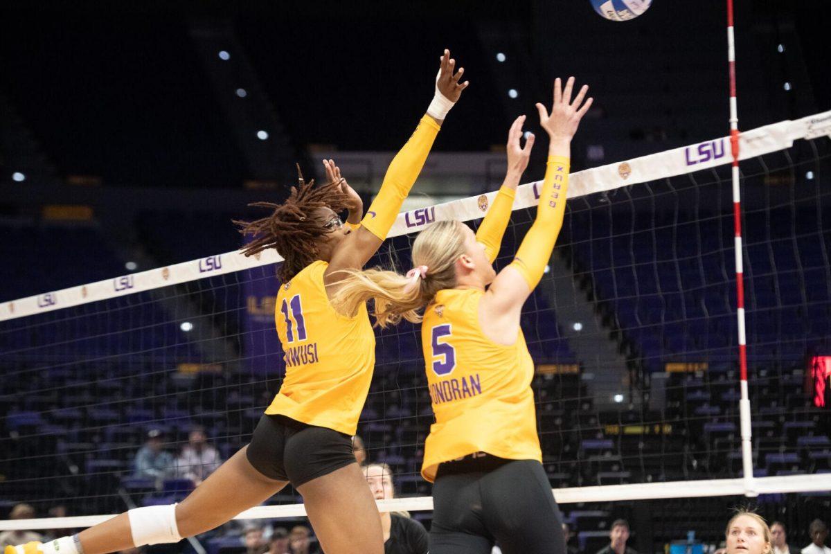 LSU volleyball senior middle blocker Anita Anwusi (11) and graduate student setter Josie Vondran (5) block the ball on Sunday, Oct. 30, 2022, during LSU&#8217;s 3-2 loss to Mississippi State at the Pete Maravich Assembly Center in Baton Rouge, La.