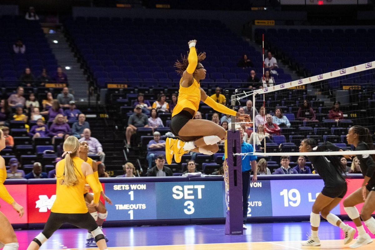 LSU volleyball senior middle blocker Anita Anwusi (11) jumps up on Sunday, Oct. 30, 2022, during LSU&#8217;s 3-2 loss to Mississippi State at the Pete Maravich Assembly Center in Baton Rouge, La.