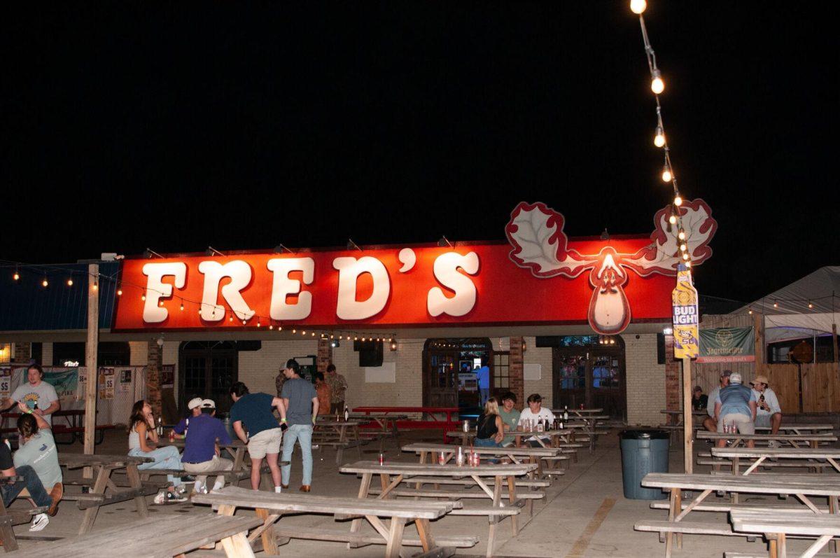 Customers enjoy the outside courtyard at Fred's in Tigerland in Baton Rouge, La on Thursday, Oct. 6, 2022.