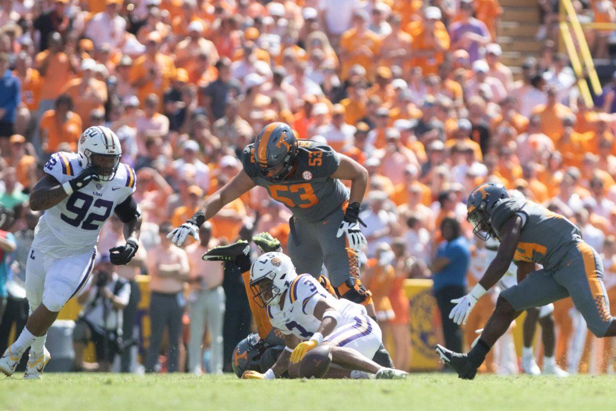 The ball comes out after LSU senior safety Greg Brooks Jr. (3) makes a tackle on Saturday, Oct. 8, 2022, during LSU's defeat to Tennessee 13-40 in Tiger Stadium.