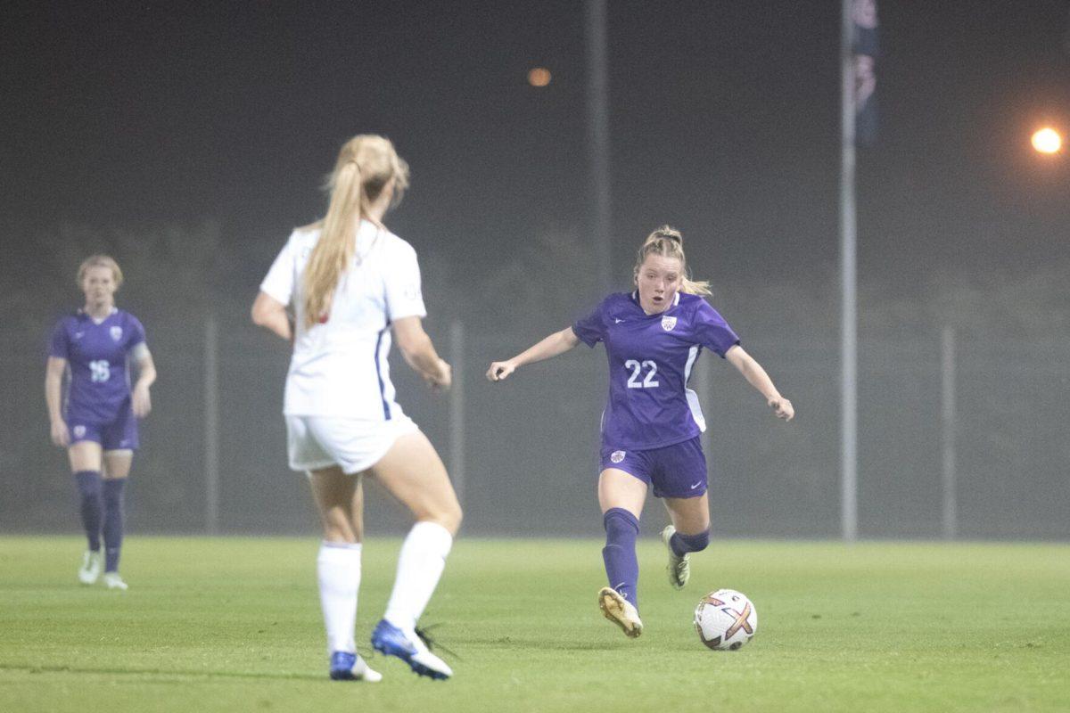 LSU soccer fifth-year senior defender Tilly Wilkes (22) passes the ball through the fog on Thursday, Oct. 27, 2022, during LSU&#8217;s 4-1 victory against Ole Miss at LSU&#8217;s Soccer Stadium off of Nicholson Drive.