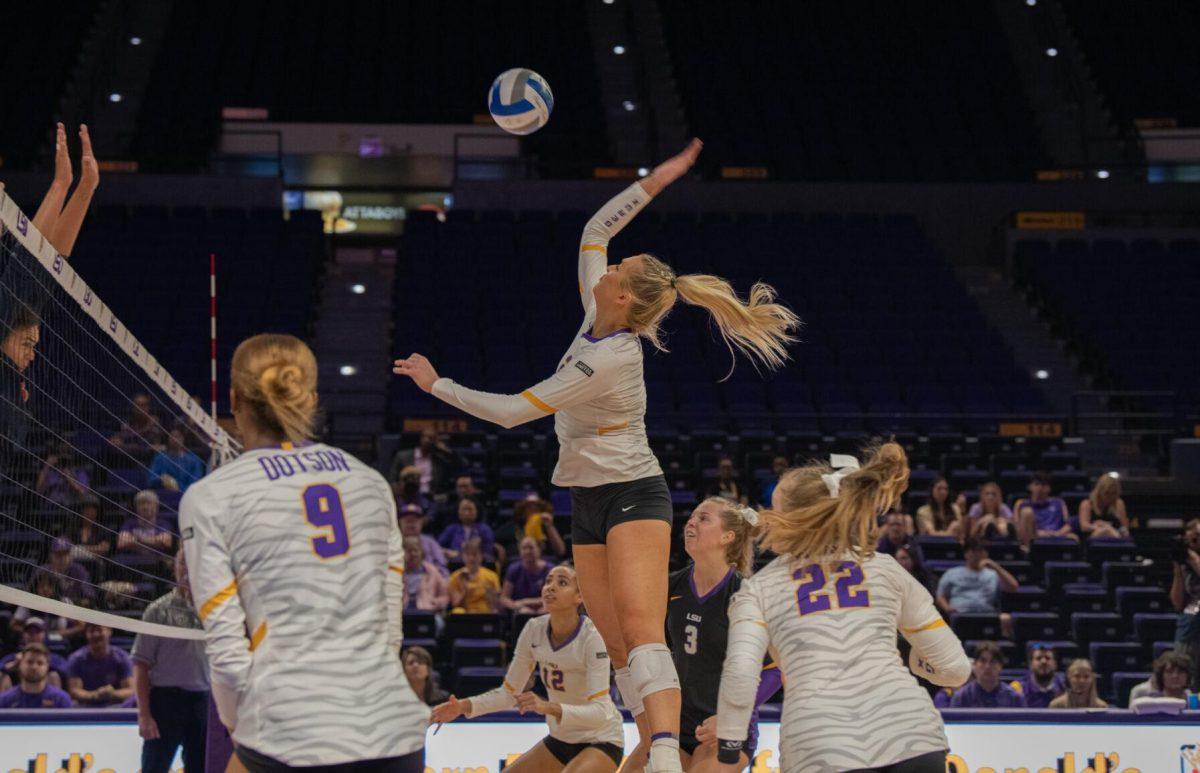 LSU volleyball graduate student right side/outside hitter Hannah Jacobs (21) leaps into the air on Wednesday, Oct. 5, 2022, before their 3-2 victory over Auburn in the Pete Maravich Assembly Center on N. Stadium Drive.