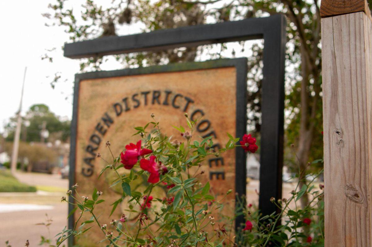 Red flowers and signage welcome guests to Garden District Coffee&#160;on Tuesday, Oct. 4, 2022. on Perkins Road in Baton Rouge, La.