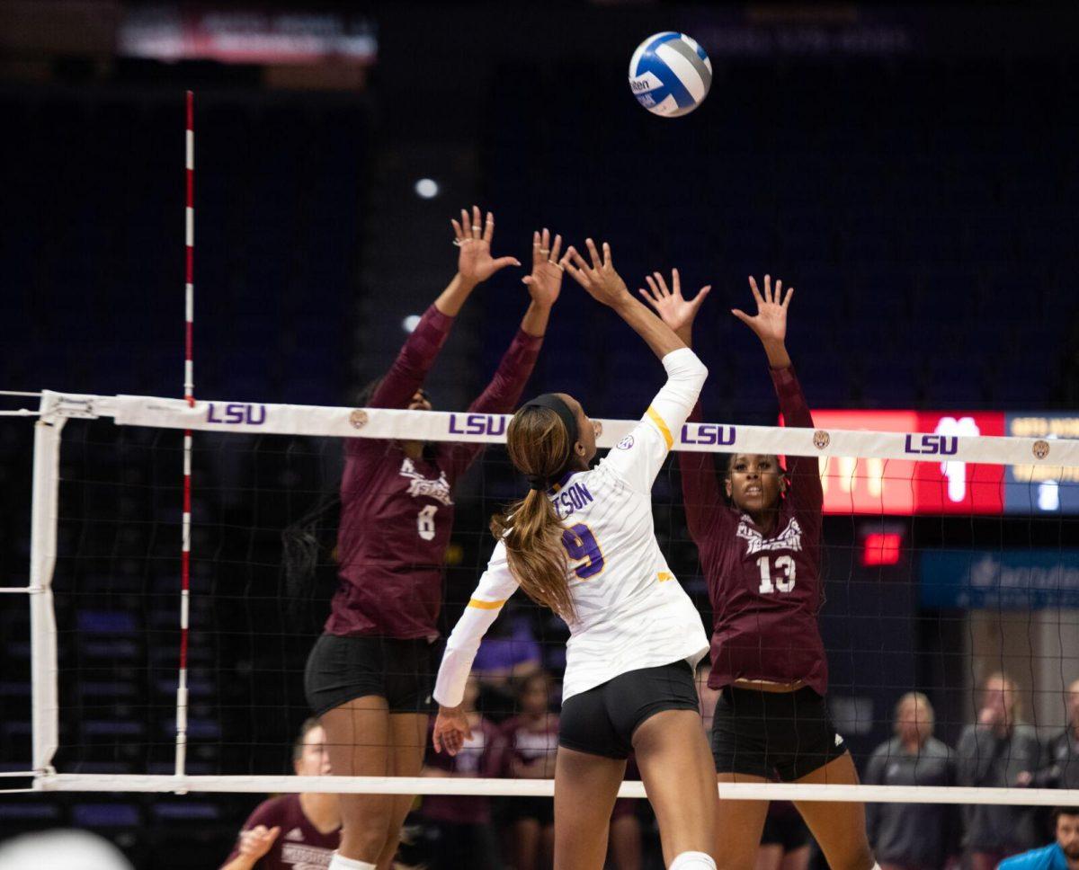 LSU volleyball senior outside hitter Sanaa Dotson (9) hits the ball over the net on Saturday, Oct. 29, 2022, during LSU&#8217;s 3-2 victory against Mississippi State at the Pete Maravich Assembly Center in Baton Rouge, La.