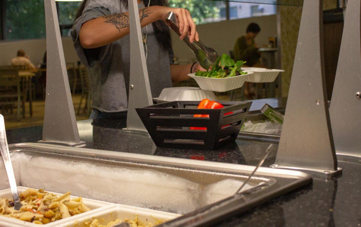 A student makes use of the salad station on Monday, Oct. 3, 2022, in The 5 Dining Hall in Baton Rouge, La.