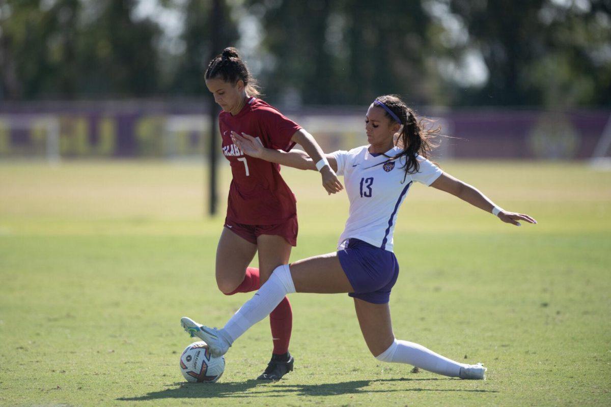 LSU soccer junior forward Taylor Dobles (13) reaches for the ball on Sunday, Oct. 9, 2022, during LSU&#8217;s defeat to Alabama 0-5 at LSU&#8217;s Soccer Stadium off Nicholson Drive.