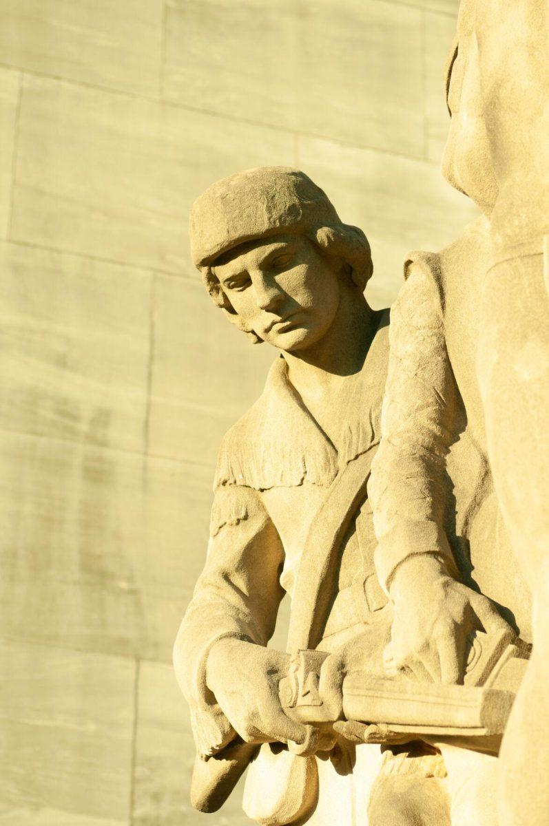 Light and shadows create depth on a statue of a man holding a rifle on Thursday, Oct. 20, 2022, at the Louisiana State Capitol in Baton Rouge, La.