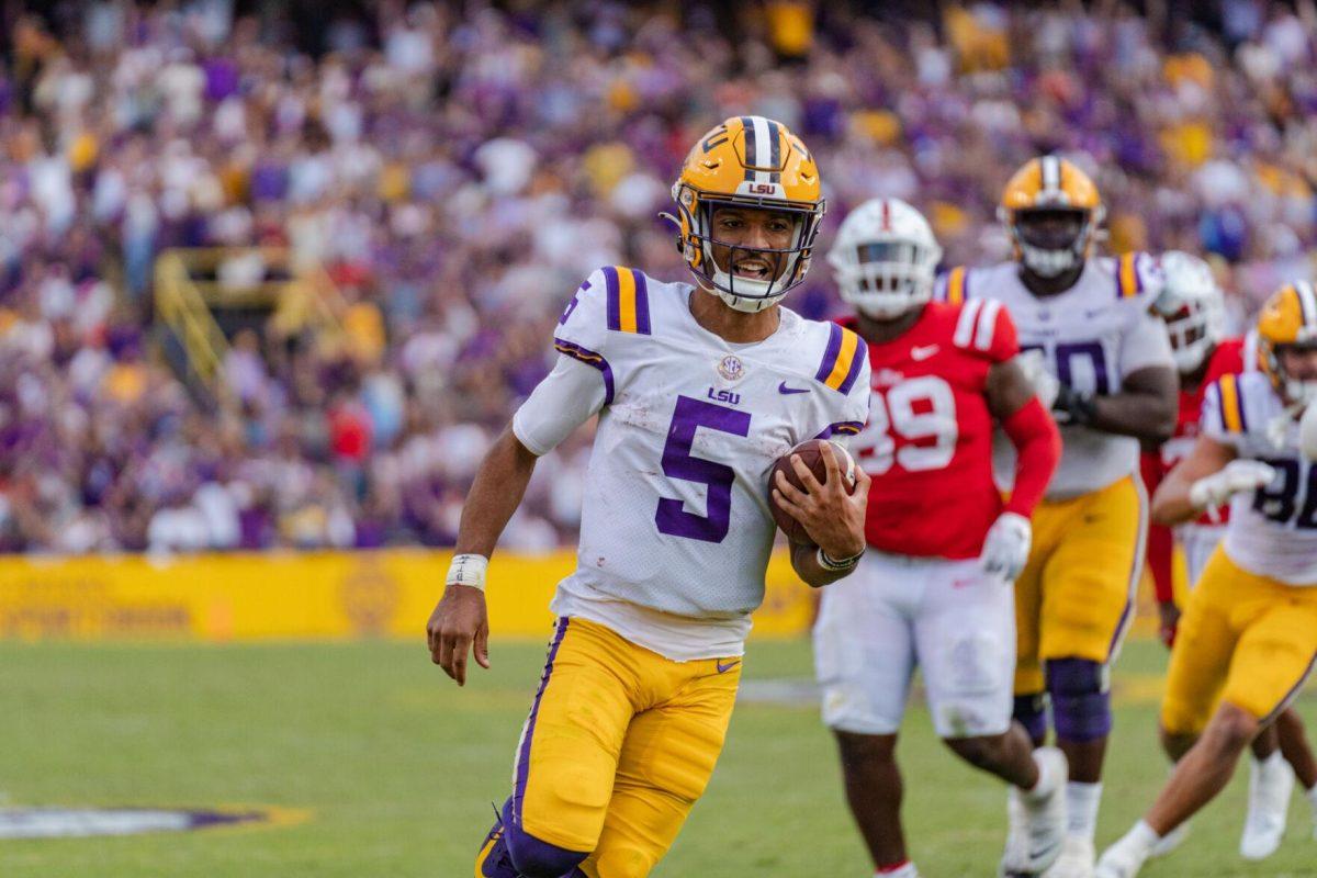 LSU football junior quarterback Jayden Daniels (5) easily finds his way to the endzone on Saturday, Oct. 22, 2022, during LSU&#8217;s 45-20 victory over Ole Miss in Tiger Stadium in Baton Rouge, La.