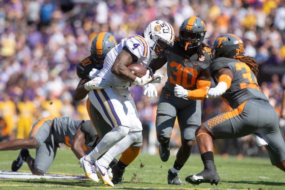 LSU senior running back John Emery Jr. (4) runs the ball on Saturday, Oct. 8, 2022, during LSU's defeat to Tennessee 13-40 in Tiger Stadium.