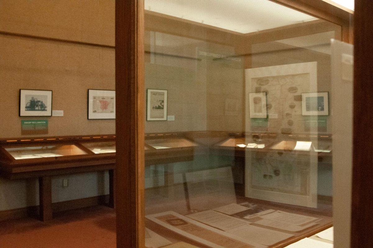 Historical documents are reflected on the display case on the second floor of Hill Memorial Library on Field House Drive Baton Rouge, La on Tuesday, Oct. 11, 2022 as part of the Water and Louisiana Consequences with Coastal Land exhibit.