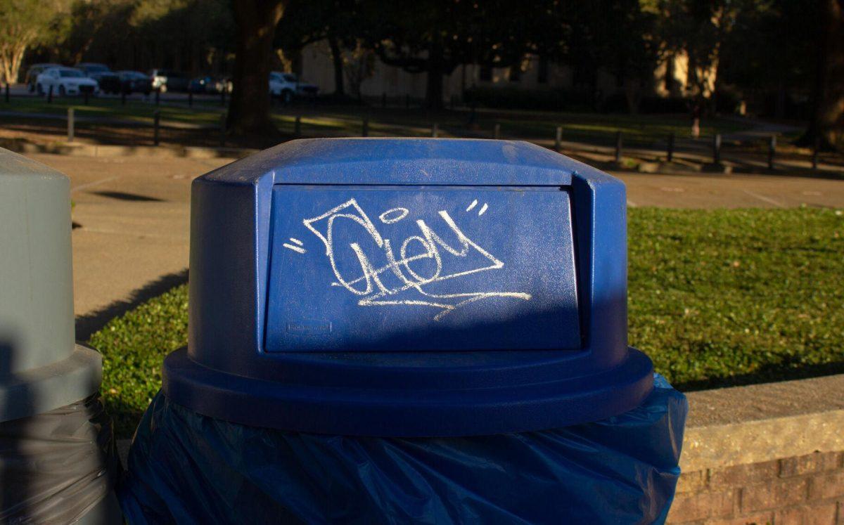 Graffiti covers the blue trash can on Monday, Sept. 26, 2022, on Dalrymple Drive in Baton Rouge, La.