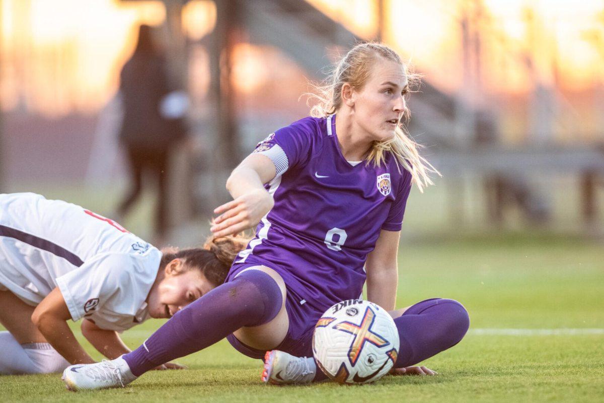 LSU soccer fifth-year senior defender Shannon Cooke (8) falls while fighting for the ball on Thursday, Oct. 27, 2022, during LSU&#8217;s 4-1 victory against Ole Miss at LSU&#8217;s Soccer Stadium off of Nicholson Drive.