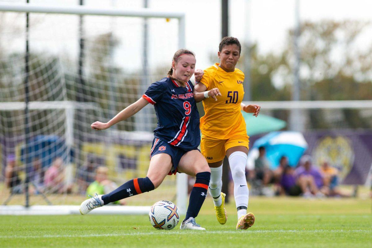 LSU soccer freshman forward Sage Glover (50) and Auburn soccer junior midfielder Hannah Waesch (9) fight for the ball Sunday, Oct. 23, 2022, during LSU women's soccer 0-0 draw against Auburn at LSU's Soccer Stadium off of Nicholson Drive.