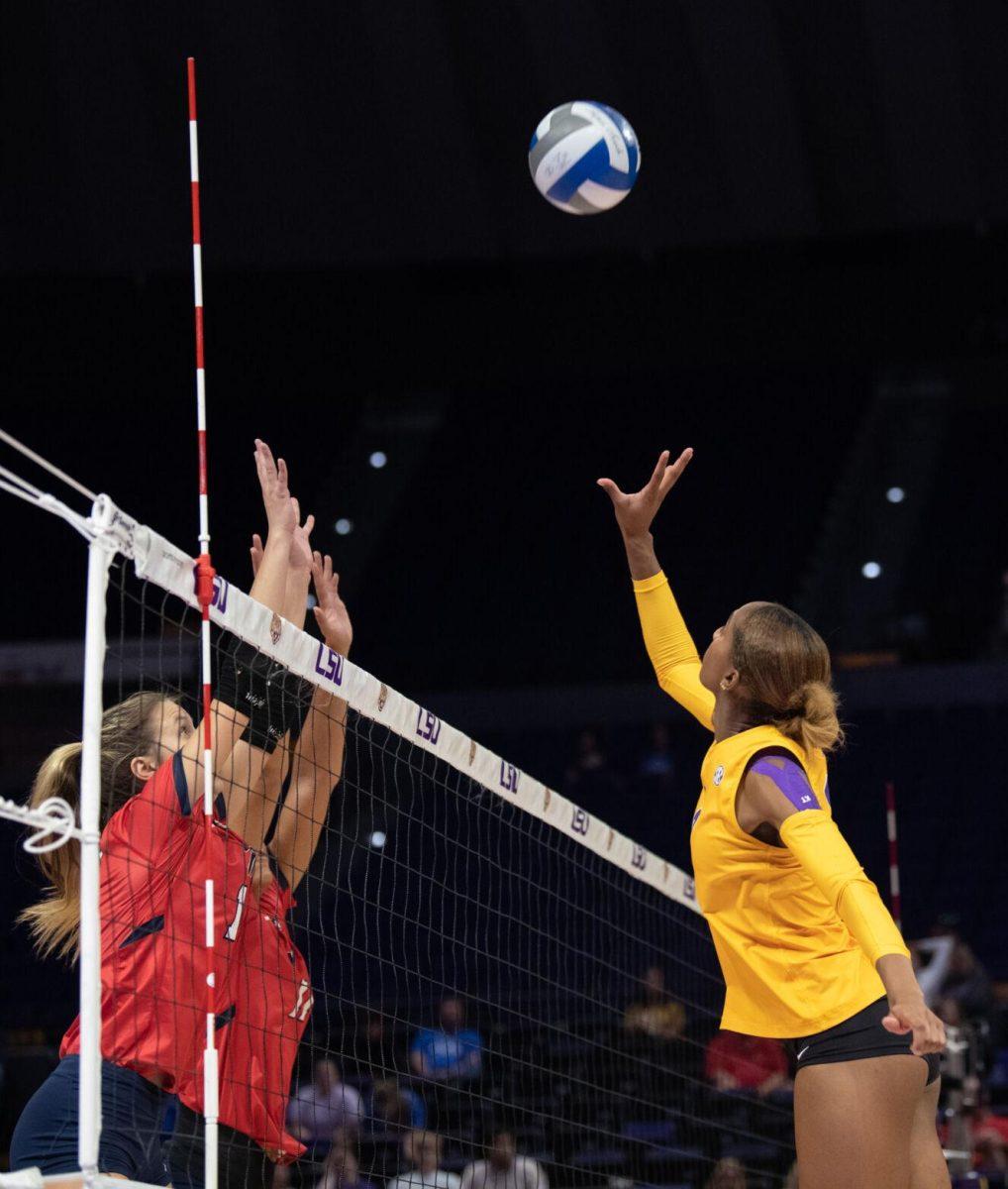 LSU volleyball senior outside hitter Sanaa Dotson (9) reaches up for the ball on Saturday, Oct. 1, 2022, during LSU&#8217;s 2-3 defeat to Ole Miss at the Pete Maravich Assembly Center in Baton Rouge, La.