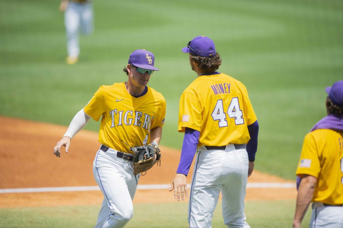 LSU baseball sophomore infielder Cade Doughty (4) high fives sophomore right-handed pitcher Blake Money (44) Sunday, May, 1, 2022, during the Tigers&#8217; 4-3 walk-off win against the Georgia Bulldogs at Alex Box Stadium in Baton Rouge, La.