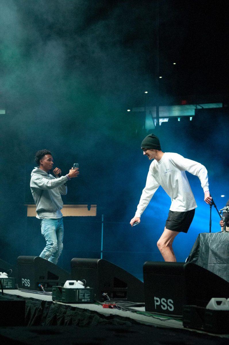 A member of the opening DJ set records a student volunteer dancing on Wednesday, Oct. 19, 2022, at LSU's homecoming concert at the PMAC on North Stadium Drive in Baton Rouge, La.