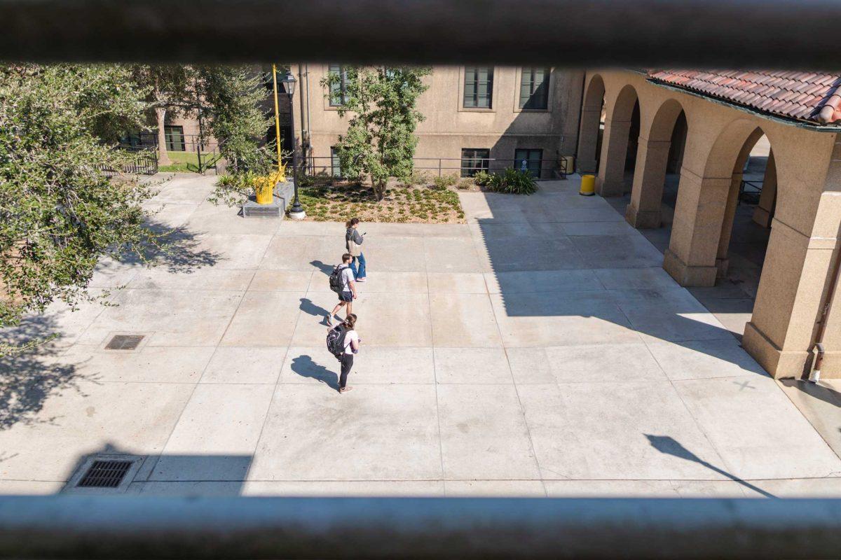 Three LSU students move toward the Quad on Friday, Oct. 7, 2022, on LSU&#8217;s campus in Baton Rouge, La.