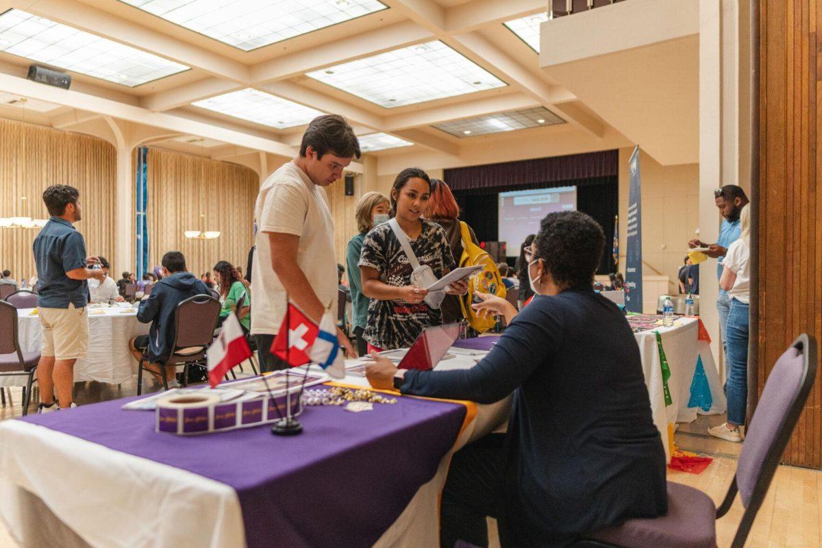 Students visit the study abroad table on Friday, Sept. 30, 2022, during Latinx Night at the LSU Union Ballroom.