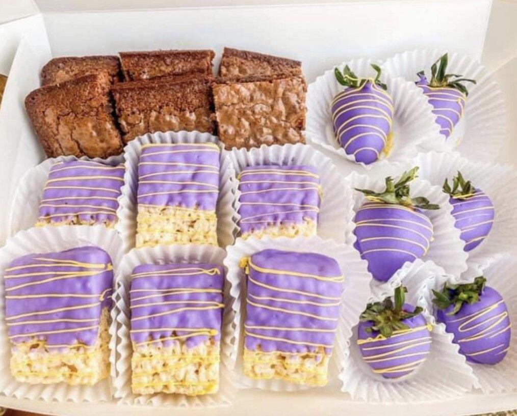 A combo box of brownies, chocolate-covered strawberries and Rice Krispies created by Independent Sweets.