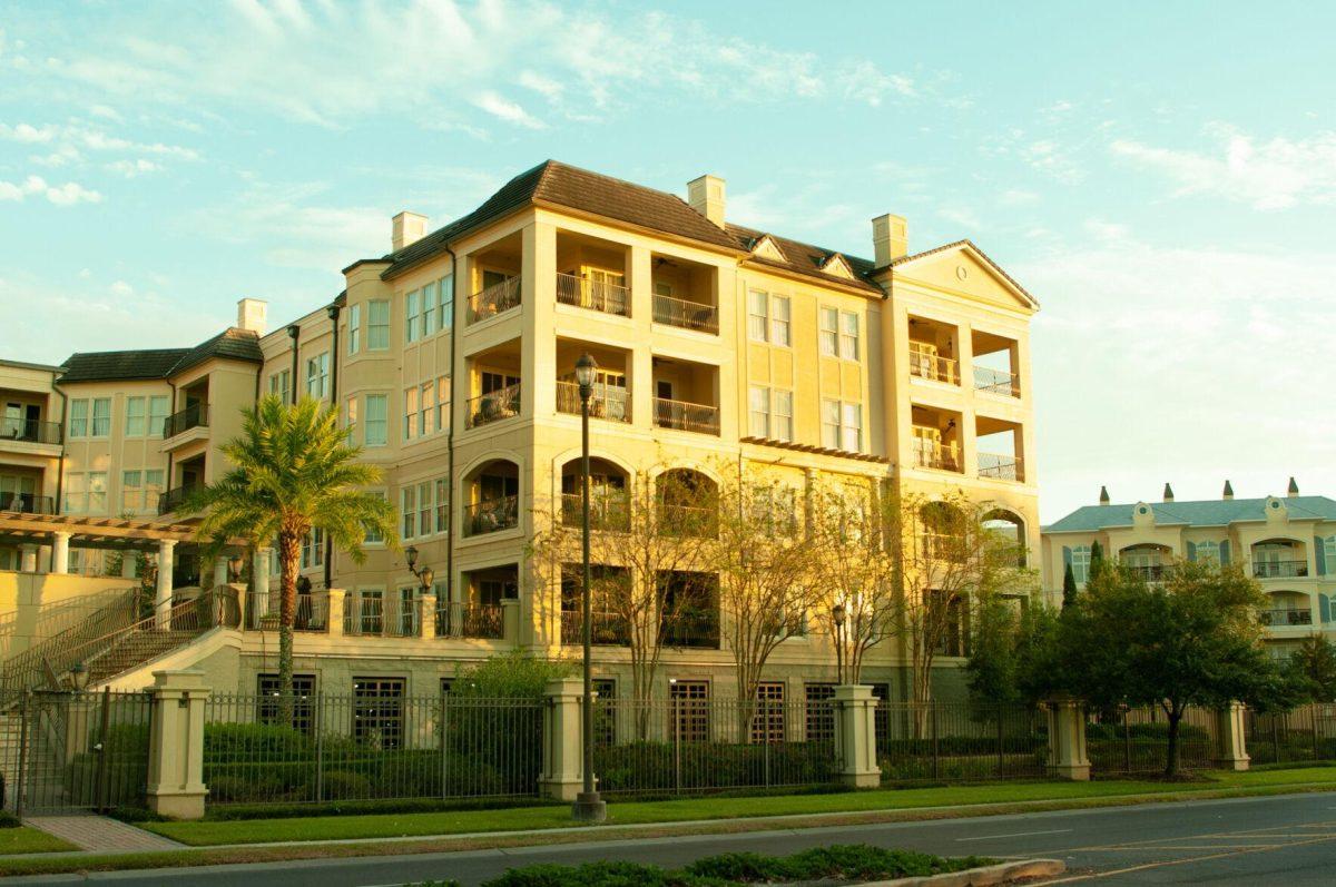 A residential building glows in the sunlight on Monday, Oct. 17, 2022, at Milford Wampold Memorial Park in Baton Rouge, La.