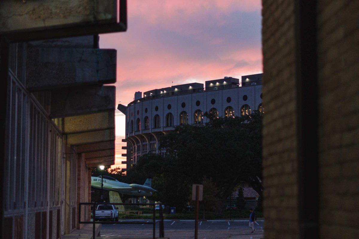 The sun sets behind Tiger Stadium on Monday, Oct. 17, 2022, on West Stadium Drive in Baton Rouge, La.