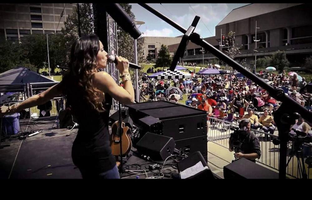 Allison Collins performs on stage with her band.&#160;