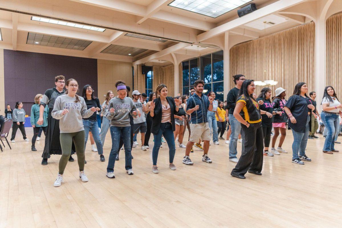 Attendees follow the dance instructor&#8217;s lead on Friday, Sept. 30, 2022, during Latinx Night at the LSU Union Ballroom.