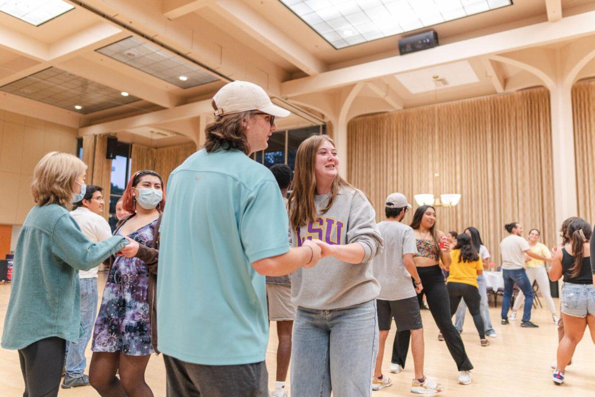 Attendees pair up for one of the dances on Friday, Sept. 30, 2022, during Latinx Night at the LSU Union Ballroom.